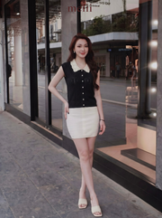 MELII black knit top with white lace collar, lifestyle front view