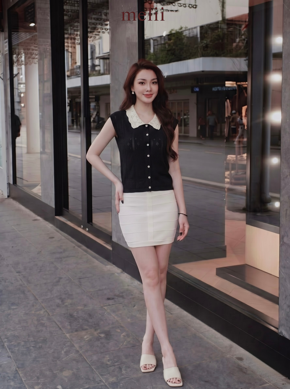MELII black knit top with white lace collar, lifestyle front view