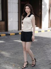 MELII ivory and black contrast-collar knit top with zip neckline, lifestyle front view
