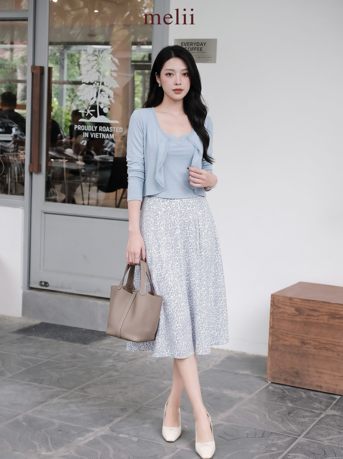 Adeline Three-Piece Cardigan Set in Powder Blue, full-length café standing view with handbag