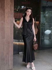 MELII Celeste Pearl Silk Set in Black, full-length front model view beside a wooden column
