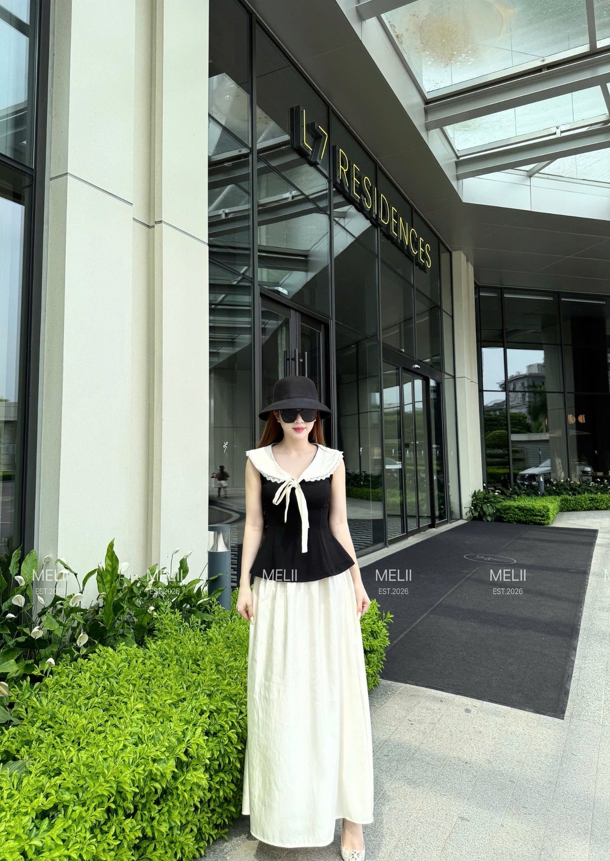 Elodie Sailor-Tie Top and Flowing Maxi Skirt Set in Noir and Ivory, third real model view
