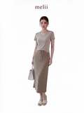 MELII Mira V-Neck Drawstring Top and Striped Maxi Skirt Set in Beige, full-length front model view on a white background