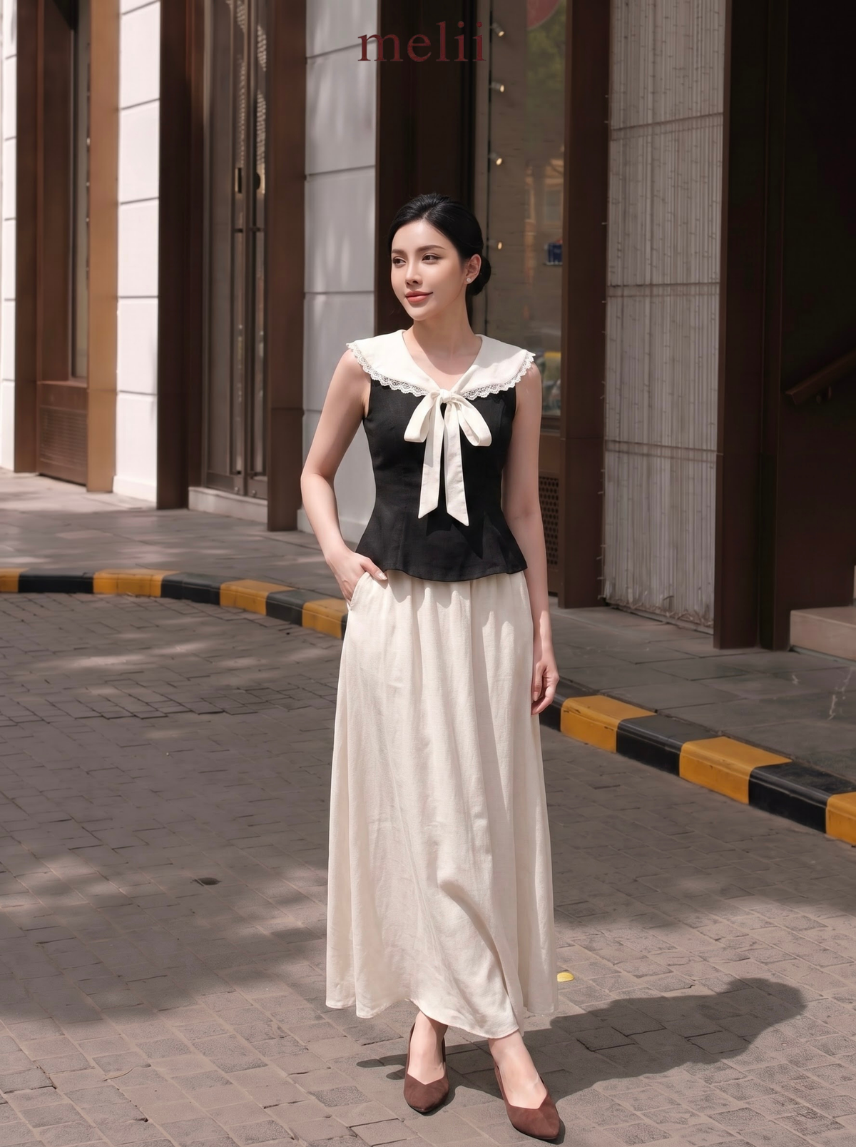 MELII Elodie sailor-tie top and ivory flowing maxi skirt set, skirt model view